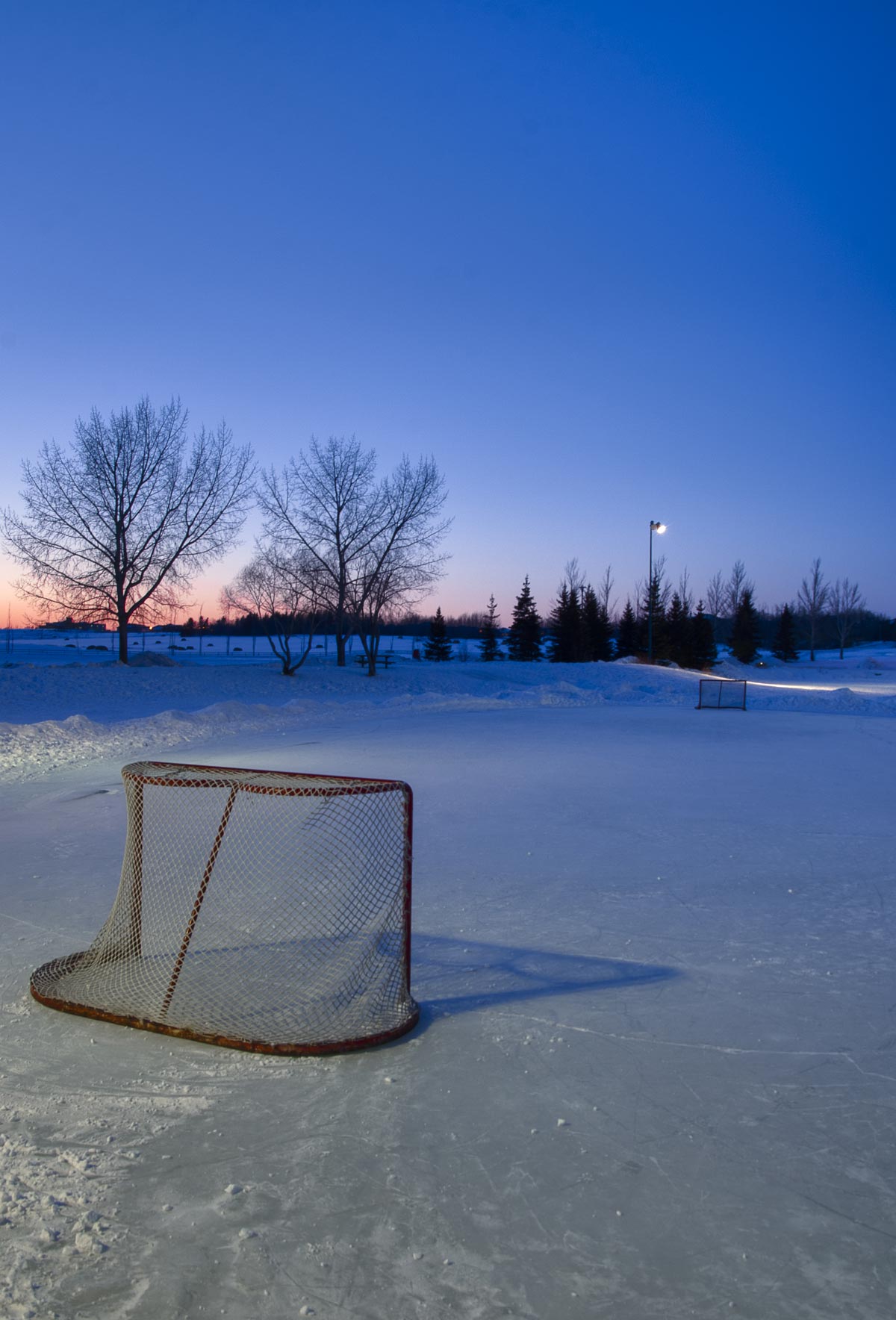 Sunset With a Vacant Pond Hockey Ring